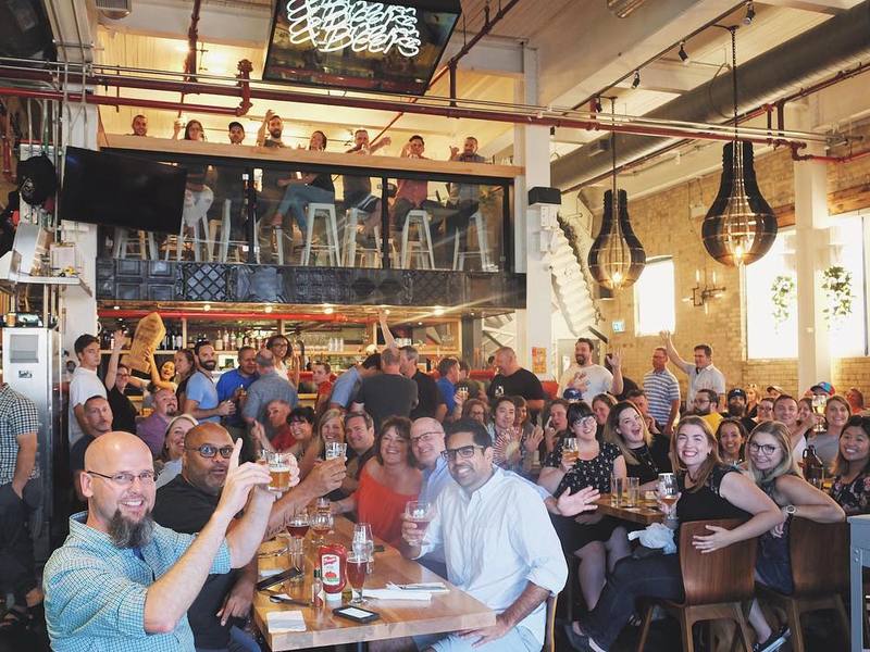 A packed room of guests celebrating at Downtown Kitchener
